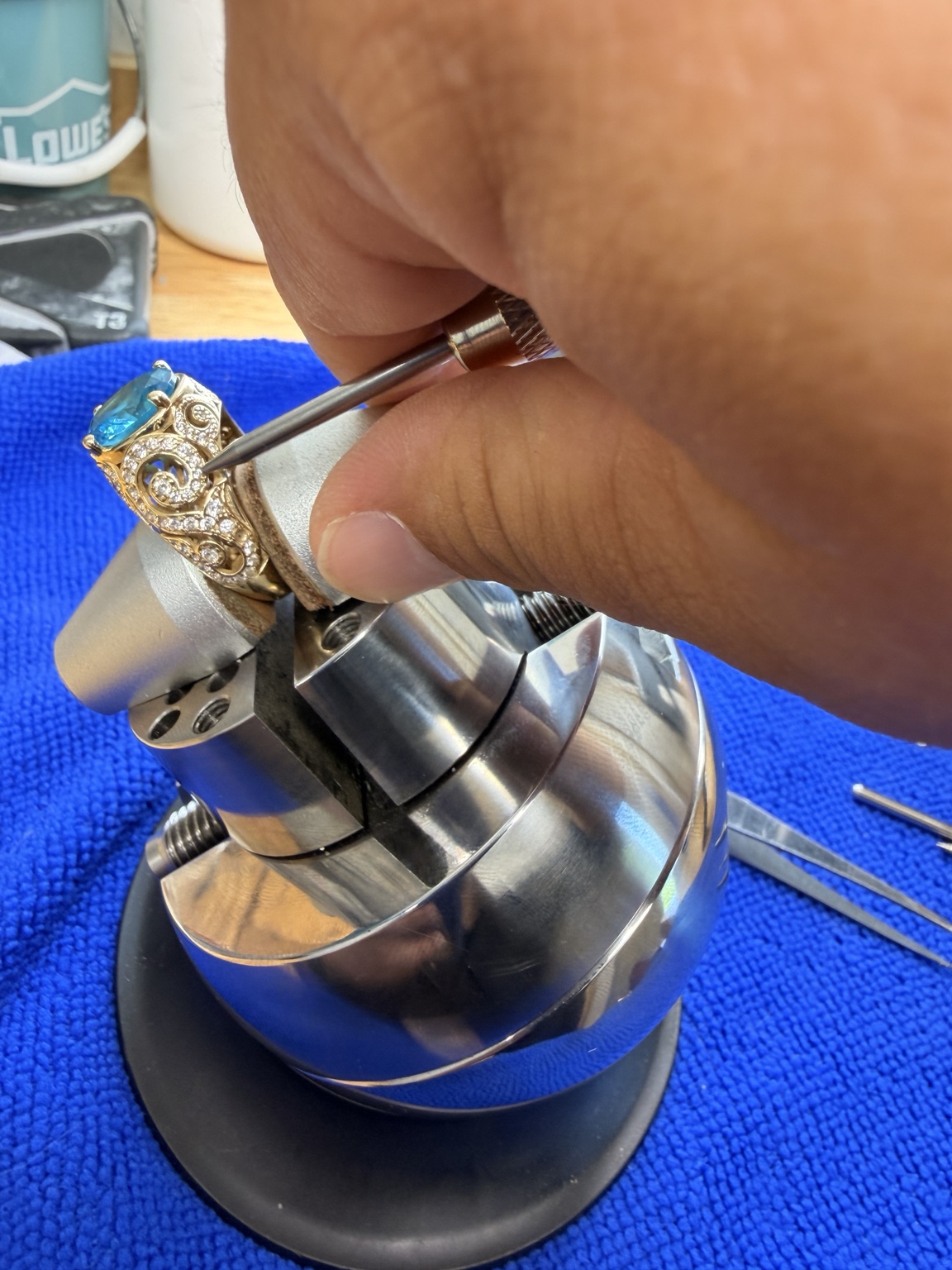 Jeweler working on a blue gemstone ring